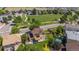Aerial shot showcasing a well-maintained backyard, neighboring homes, and community green space, ideal for families at 6260 E 114Th Ave, Thornton, CO 80233