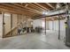 An unfinished basement area with exposed ceiling beams and concrete flooring, ready for customization at 6260 E 114Th Ave, Thornton, CO 80233