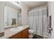 Functional bathroom with a shower-tub combination and a well-lit vanity area at 6260 E 114Th Ave, Thornton, CO 80233