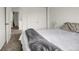 Bright bedroom featuring neutral decor and a view down the hallway at 6260 E 114Th Ave, Thornton, CO 80233