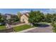 Inviting exterior of this home with a lush front lawn and mature tree providing shade at 6260 E 114Th Ave, Thornton, CO 80233