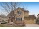 Inviting two-story home with a combination of stone and siding, providing a cozy and stylish curb appeal at 6260 E 114Th Ave, Thornton, CO 80233