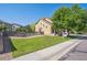 A charming front yard with a green lawn, mature tree and a real estate sign at 6260 E 114Th Ave, Thornton, CO 80233