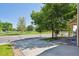 Spacious front yard with mature trees, offering a scenic view of the neighborhood park and surrounding greenery at 6260 E 114Th Ave, Thornton, CO 80233