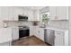 Kitchen with stainless steel appliances and stone backsplash at 6260 E 114Th Ave, Thornton, CO 80233