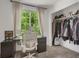 Bright office space with a view of the backyard, features a closet and a desk at 6260 E 114Th Ave, Thornton, CO 80233