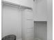 White closet with a tall cabinet, shelving, and clothing rod at 720 16Th St # 311, Denver, CO 80202