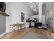 Living room featuring hardwood floors, neutral-colored walls, and a kitchen area at 720 16Th St # 311, Denver, CO 80202