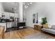 Open-concept living room featuring modern furnishings, hardwood floors, and a kitchen area at 720 16Th St # 311, Denver, CO 80202