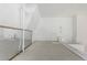 Bright loft area features a built-in mirror, plush carpet, and ample natural light at 720 16Th St # 311, Denver, CO 80202