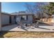 Backyard patio with a fire pit and outdoor seating, perfect for entertaining at 2605 Crabapple Ct, Golden, CO 80401