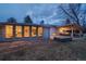 Backyard featuring a covered patio with built-in grill and dining area, with views into the interior through large windows at 2605 Crabapple Ct, Golden, CO 80401