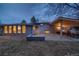 Spacious backyard featuring a covered patio with built-in grill and dining area for outdoor gatherings at 2605 Crabapple Ct, Golden, CO 80401