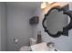 Cozy bathroom with decorative mirror, modern fixtures, and neutral color scheme at 2605 Crabapple Ct, Golden, CO 80401