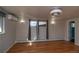 A bright bedroom with a lovely hardwood floor, large windows, and modern fan at 2605 Crabapple Ct, Golden, CO 80401