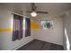 A neutral tone room with carpet, yellow stripe and curtains hanging from the windows at 2605 Crabapple Ct, Golden, CO 80401