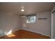 A cozy bedroom with natural light, smooth hardwood floor, and a closet at 2605 Crabapple Ct, Golden, CO 80401
