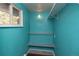 A charming closet with custom shelves and a unique blue color at 2605 Crabapple Ct, Golden, CO 80401