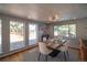 Bright dining area featuring hardwood floors, natural light, and stylish decor for comfortable dining at 2605 Crabapple Ct, Golden, CO 80401