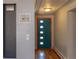 Inviting entryway with a modern door, hardwood floors, and stylish decor at 2605 Crabapple Ct, Golden, CO 80401