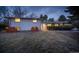 Charming one-story home with gray brick, manicured lawn, and mature trees, offering a serene setting at 2605 Crabapple Ct, Golden, CO 80401