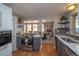 Well-equipped kitchen with modern appliances, quartz countertops, and hardwood flooring at 2605 Crabapple Ct, Golden, CO 80401