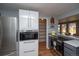 Well-designed kitchen showcasing stainless steel appliances, ample cabinet space, and an adjacent pantry at 2605 Crabapple Ct, Golden, CO 80401