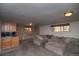 An expansive living room area with wet bar and comfortable gray sofa at 2605 Crabapple Ct, Golden, CO 80401