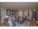 Cozy living room with modern decor, neutral colors, hardwood floors, and ample seating at 2605 Crabapple Ct, Golden, CO 80401