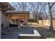 Outdoor patio area with a built-in grill, seating, and a covered dining space at 2605 Crabapple Ct, Golden, CO 80401
