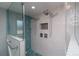 A stylish shower featuring glass and sleek fixtures, including dual shower heads at 2605 Crabapple Ct, Golden, CO 80401