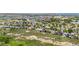 An aerial shot showing a neighborhood with a variety of home styles surrounded by trees at 473 Somerset Dr, Golden, CO 80401