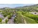 Scenic aerial shot featuring homes nestled on a verdant hillside with walking path at 473 Somerset Dr, Golden, CO 80401