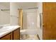 Simple bathroom with tub/shower combo, double vanity, and linoleum flooring at 473 Somerset Dr, Golden, CO 80401