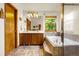 Bright bathroom featuring double vanity, garden tub, and tiled floor at 473 Somerset Dr, Golden, CO 80401