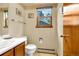 Cozy half-bathroom featuring a window view, perfect for natural light at 473 Somerset Dr, Golden, CO 80401