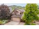 Charming two-story home featuring an attached two-car garage and a meticulously landscaped front yard at 473 Somerset Dr, Golden, CO 80401