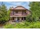 Charming house with a spacious double-decker deck nestled amongst beautiful green landscaping at 473 Somerset Dr, Golden, CO 80401