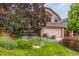 Charming home with meticulously landscaped front yard with flowers and mature trees at 473 Somerset Dr, Golden, CO 80401