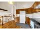 Bright kitchen with hardwood floors, staircase and dark wood cabinetry at 473 Somerset Dr, Golden, CO 80401