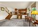 Open floor plan living area with staircase, hardwood trim and railing at 473 Somerset Dr, Golden, CO 80401