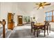 Inviting living room with neutral carpet, dining set, and front door entrance at 473 Somerset Dr, Golden, CO 80401