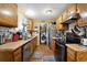 Kitchen featuring wooden cabinets, stainless steel appliances, and laminate countertops at 6314 W 92Nd Pl, Westminster, CO 80031