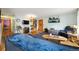 Comfortable living room featuring hardwood floors and a TV at 6314 W 92Nd Pl, Westminster, CO 80031