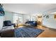 Inviting living room with hardwood floors, large windows, and comfortable seating at 6314 W 92Nd Pl, Westminster, CO 80031