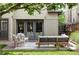 Inviting backyard patio with comfortable seating, lush greenery, and brick accents at 1272 S Milwaukee St, Denver, CO 80210
