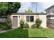 Charming backyard studio with blooming roses and lush landscaping, offering a private retreat at 1272 S Milwaukee St, Denver, CO 80210