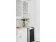 Stylish bar area with white cabinets, subway tile backsplash, and a beverage fridge at 1272 S Milwaukee St, Denver, CO 80210