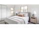 Cozy bedroom featuring a comfortable bed, neutral colors, and plenty of light at 1272 S Milwaukee St, Denver, CO 80210