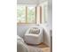 Bright bedroom with a chair and two windows at 1272 S Milwaukee St, Denver, CO 80210
